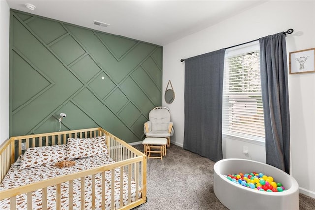 187 Lyndhurst Dr, Bethlehem, GA 30620 - carpeted bedroom featuring a crib and baseboards