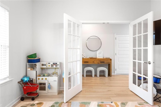 187 Lyndhurst Dr, Bethlehem, GA 30620 - playroom with french doors, wood finished floors, and baseboards