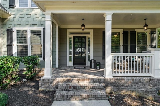 doorway to property featuring a porch