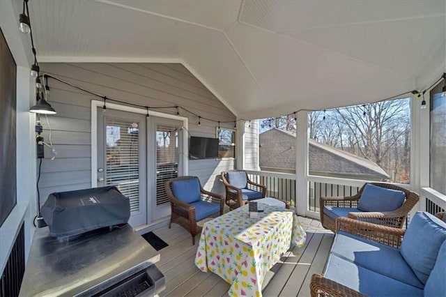 wooden deck featuring an outdoor living space and a grill