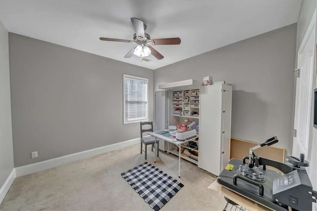 office space with light colored carpet and ceiling fan