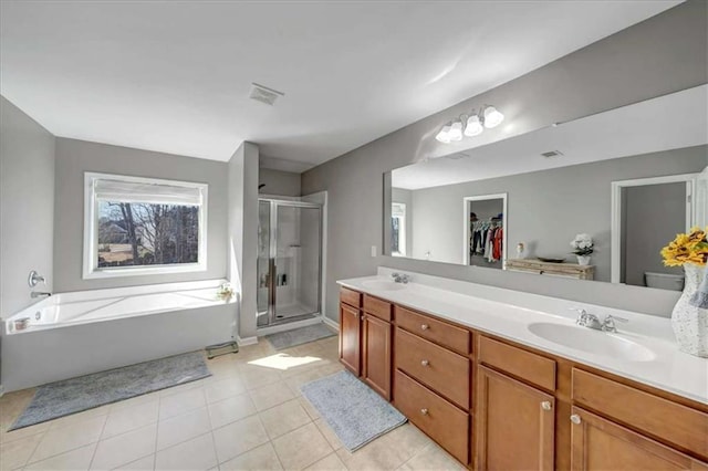 bathroom with vanity, independent shower and bath, and tile patterned flooring