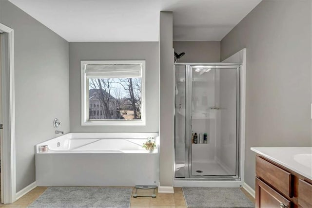 bathroom with vanity, separate shower and tub, and tile patterned floors