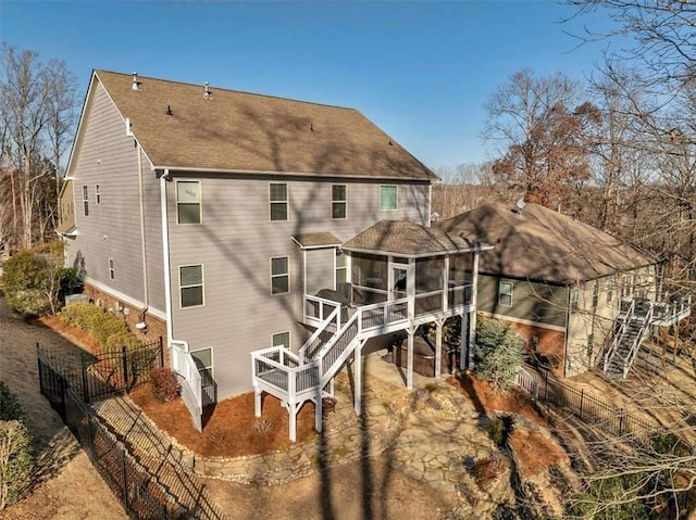 back of property featuring a sunroom