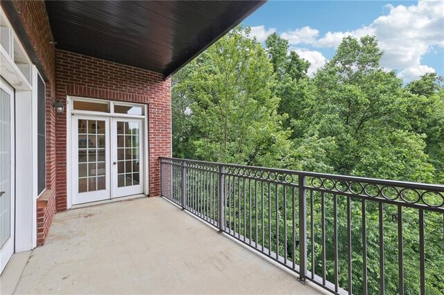 3280 Stillhouse Ln SE Unit 212, Atlanta, GA 30339 - bedroom with crown molding, recessed lighting, carpet, baseboards, and connected bathroom