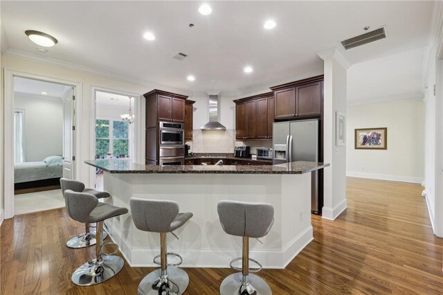 3280 Stillhouse Ln SE Unit 212, Atlanta, GA 30339 - living room featuring hardwood / wood-style floors, a lit fireplace, ornamental molding, baseboards, and recessed lighting