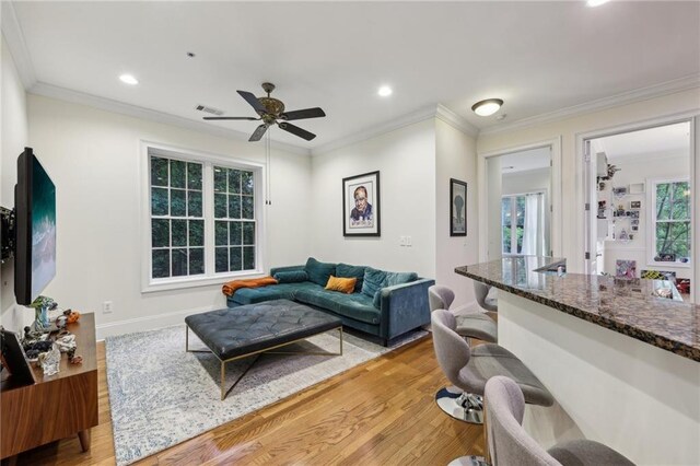 3280 Stillhouse Ln SE Unit 212, Atlanta, GA 30339 - unfurnished living room with ornate columns, light wood-style floors, ornamental molding, recessed lighting, and baseboards