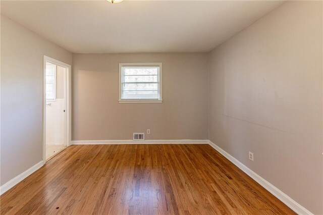 empty room featuring hardwood / wood-style floors