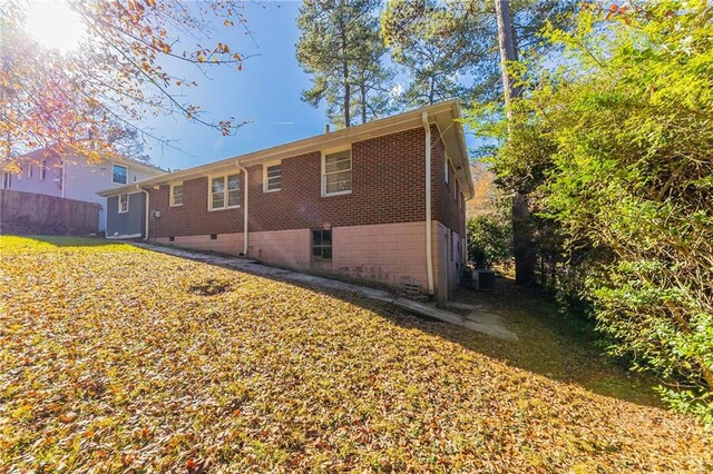 rear view of house featuring central AC unit