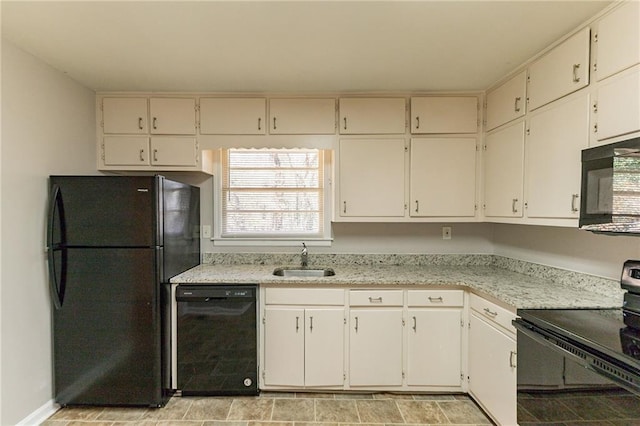 kitchen with sink, white cabinets, and black appliances