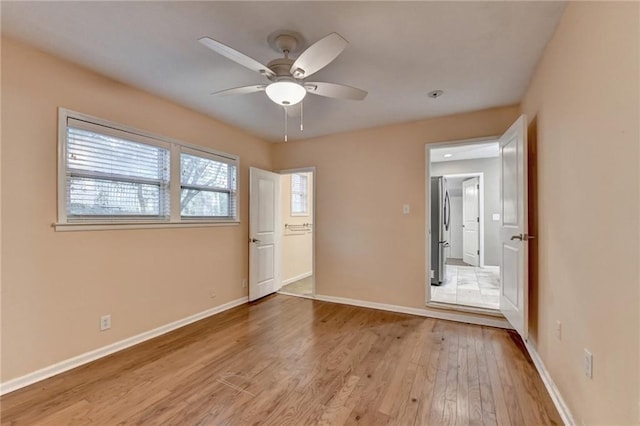 interior space with ceiling fan and light hardwood / wood-style floors