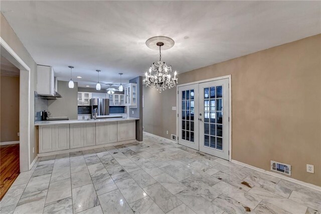 full bathroom with vanity, tiled shower / bath combo, tile walls, tile patterned flooring, and toilet