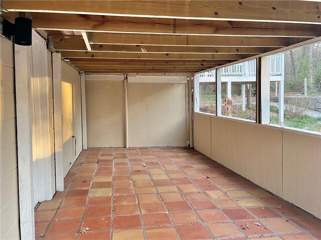 rear view of property featuring a wooden deck