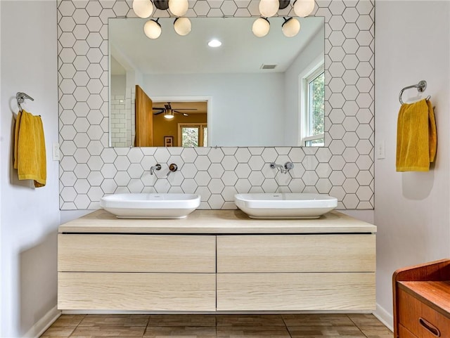 bathroom featuring backsplash and vanity