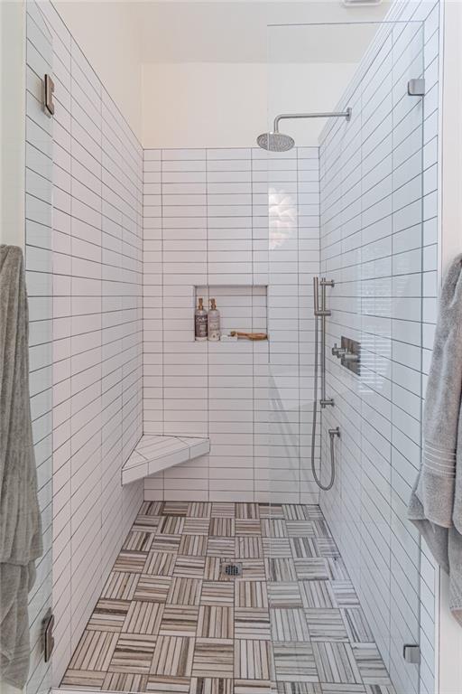 full bathroom featuring a shower stall