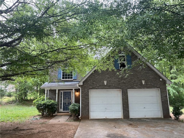 traditional home with brick siding and driveway