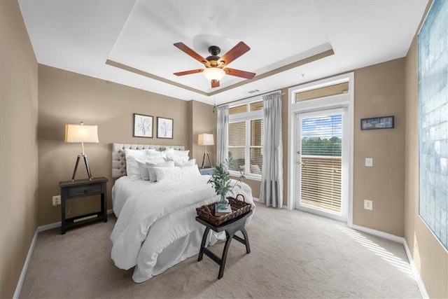 3334 Peachtree Rd NE Unit 608, Atlanta, GA 30326 - bedroom featuring a raised ceiling, access to outside, baseboards, and carpet floors