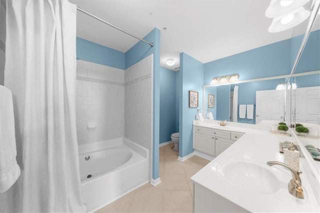 3334 Peachtree Rd NE Unit 608, Atlanta, GA 30326 - bathroom featuring tile patterned floors, shower / bathtub combination with curtain, vanity, toilet, and baseboards