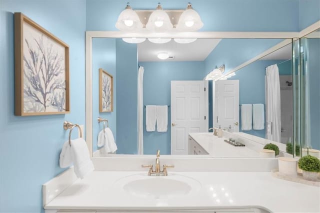 3334 Peachtree Rd NE Unit 608, Atlanta, GA 30326 - bathroom featuring double vanity and a shower with shower curtain