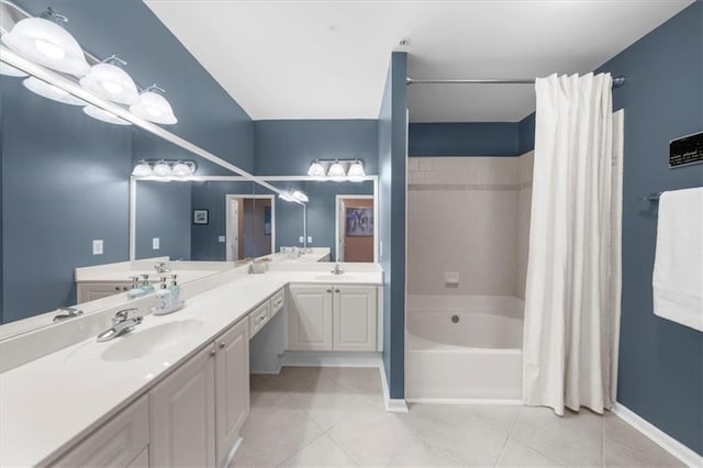 3334 Peachtree Rd NE Unit 608, Atlanta, GA 30326 - bathroom featuring tile patterned flooring, double vanity, shower / bath combo with shower curtain, and baseboards
