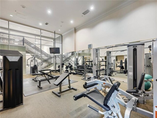 3334 Peachtree Rd NE Unit 608, Atlanta, GA 30326 - workout area with crown molding, a high ceiling, and recessed lighting
