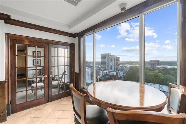 3334 Peachtree Rd NE Unit 608, Atlanta, GA 30326 - dining room featuring a view of city, plenty of natural light, light tile patterned flooring, and french doors