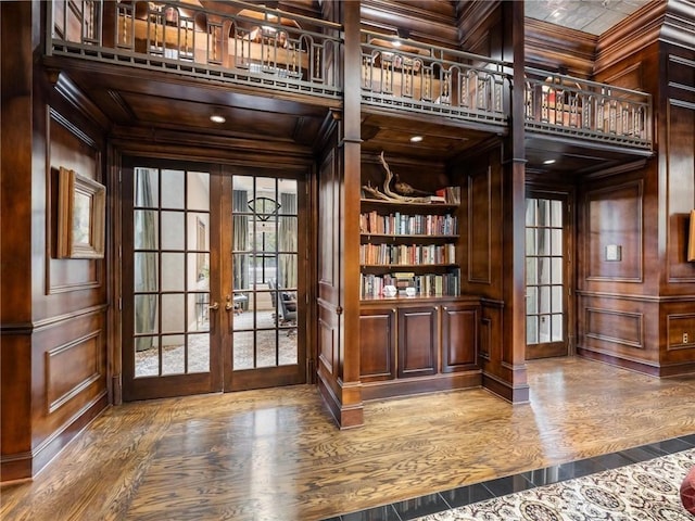 3334 Peachtree Rd NE Unit 608, Atlanta, GA 30326 - doorway to outside featuring french doors, wood finished floors, a decorative wall, built in features, and wood walls