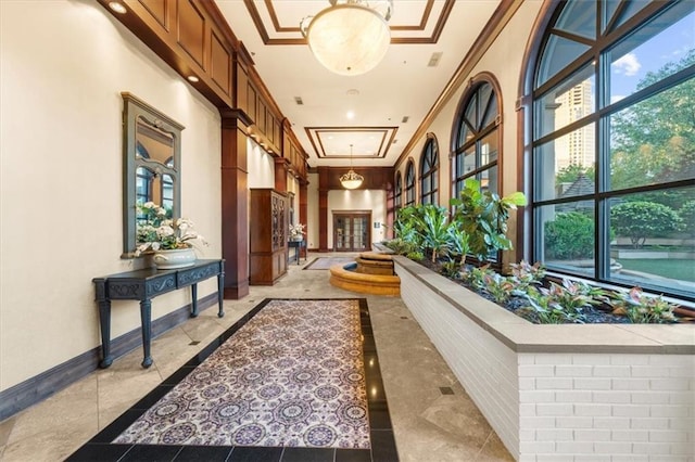 3334 Peachtree Rd NE Unit 608, Atlanta, GA 30326 - corridor featuring baseboards, attic access, and crown molding