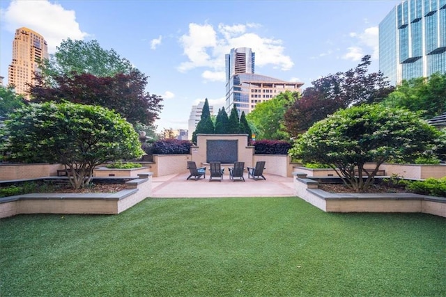3334 Peachtree Rd NE Unit 608, Atlanta, GA 30326 - view of green lawn with a patio area