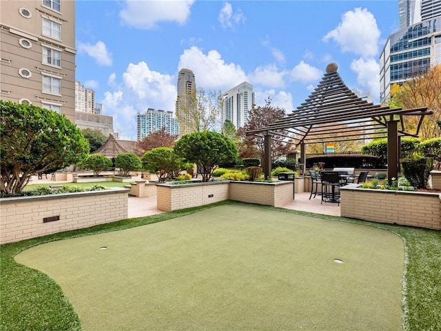 3334 Peachtree Rd NE Unit 608, Atlanta, GA 30326 - view of property's community with an area to practice putting, a gazebo, a patio area, and a city view