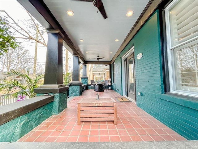 view of patio featuring ceiling fan