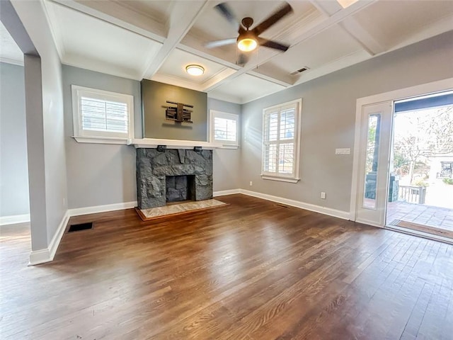 unfurnished living room with ceiling fan, a fireplace, hardwood / wood-style floors, beamed ceiling, and coffered ceiling