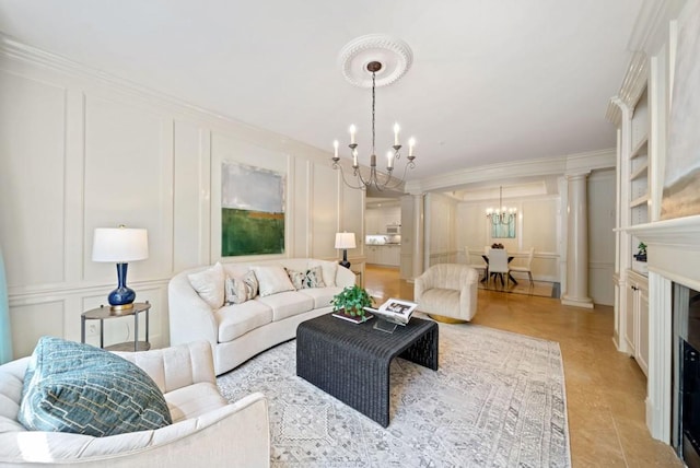 living room with ornamental molding and a chandelier