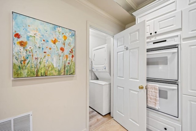 kitchen featuring white cabinetry, backsplash, white appliances, and ornamental molding