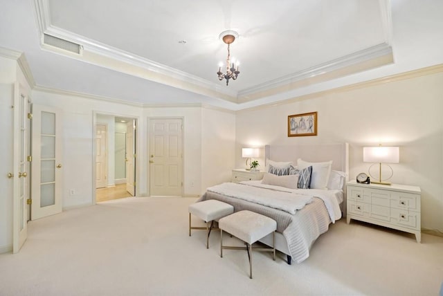 carpeted bedroom with crown molding, a chandelier, and a tray ceiling