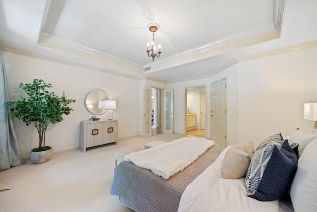 carpeted bedroom featuring an inviting chandelier, ornamental molding, and a raised ceiling