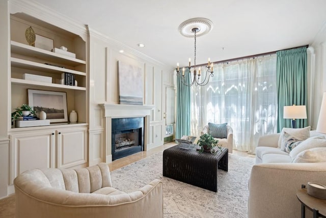 living room with an inviting chandelier, light tile patterned floors, and crown molding