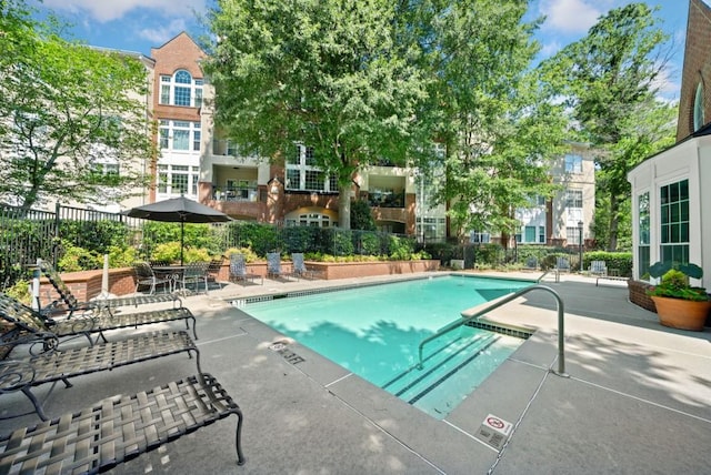 view of pool featuring a patio