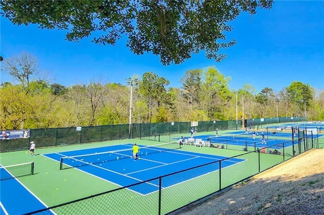 view of sport court featuring community basketball court and fence