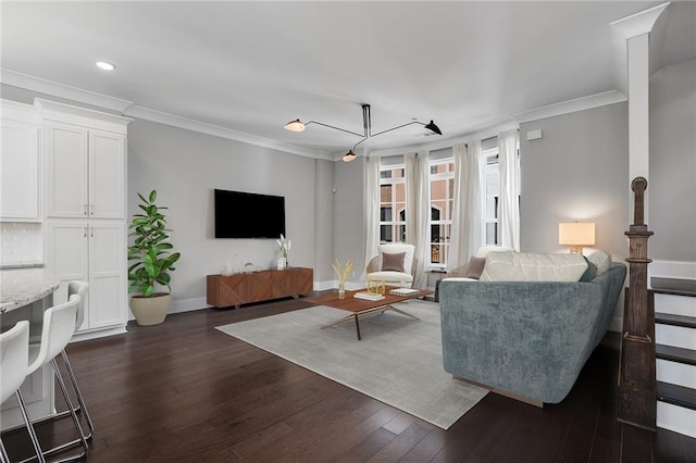 living room featuring dark hardwood / wood-style floors and ornamental molding