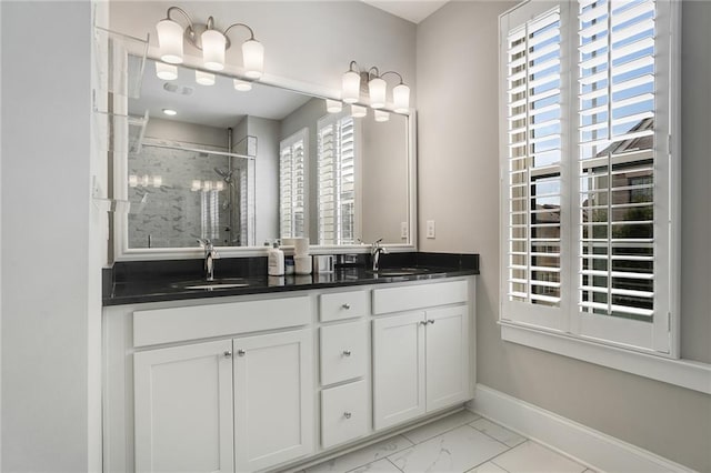 bathroom featuring vanity and an enclosed shower