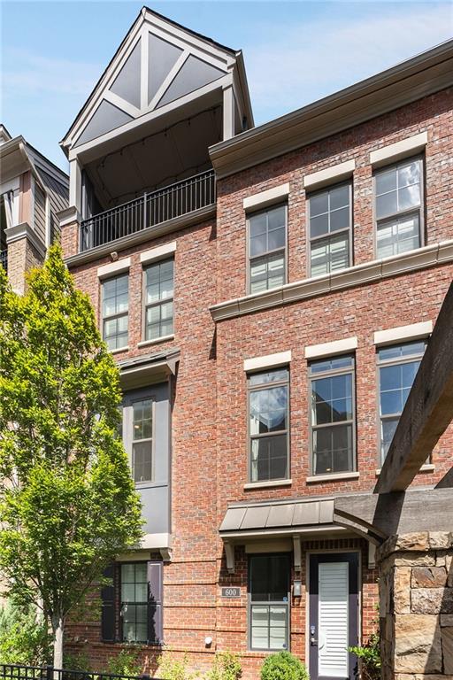 view of front of property with a balcony