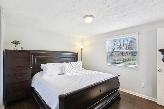 10475 Willow Meadow Cir, Alpharetta, GA 30022 - bedroom featuring dark wood-style flooring and a textured ceiling