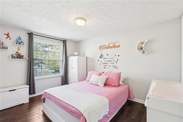 10475 Willow Meadow Cir, Alpharetta, GA 30022 - bedroom featuring dark wood-style flooring and a textured ceiling