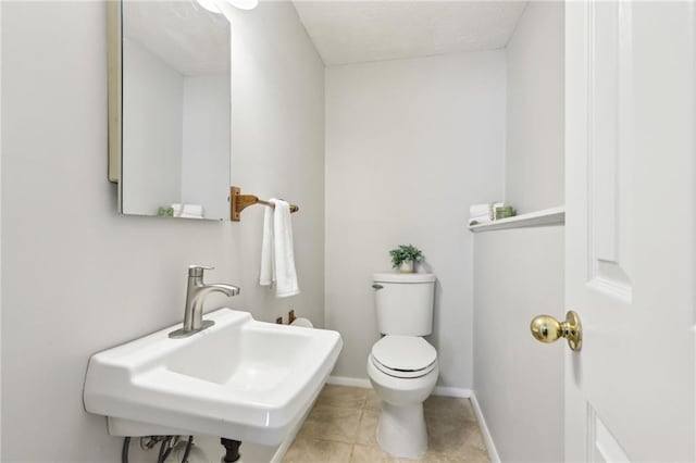 10475 Willow Meadow Cir, Alpharetta, GA 30022 - half bathroom with toilet and tile patterned floors