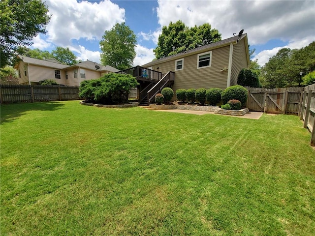 10475 Willow Meadow Cir, Alpharetta, GA 30022 - fenced backyard with stairs, a wooden deck, and a gate