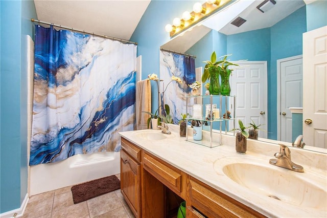 bathroom featuring vanity, tile patterned flooring, and shower / tub combo