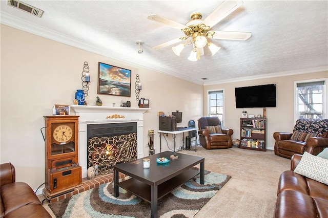 living room with carpet floors, a healthy amount of sunlight, and ornamental molding