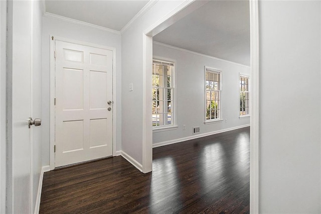 entrance foyer with dark hardwood / wood-style flooring and ornamental molding