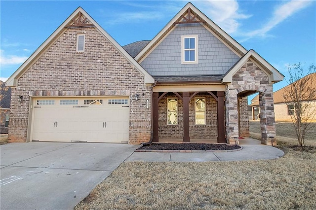 view of front of home with a porch, a garage, and a front lawn